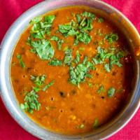 Dal Makhani · Black beans cooked with butter and Indian spices.