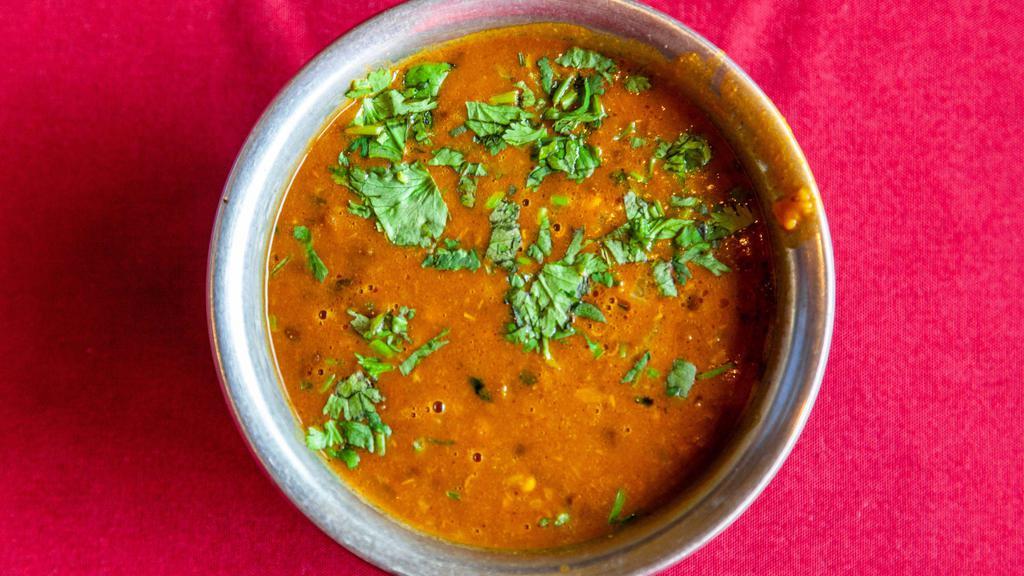 Dal Makhani · Black beans cooked with butter and Indian spices.