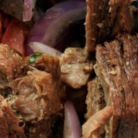 Gyro Lamb · Lettuce, tomato, onions, pickles and tzatziki sauce on a pita.