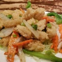 Salt & Pepper Squid · Hot and spicy. Served with green pepper, onion, and fried butter.
