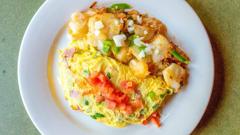 Western Omelette · Ham, onion, and peppers. Served with home fries and toast.