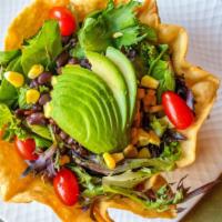 Southwestern Salad · Mixed greens, avocado, tomatoes, corn, black beans and cajun ranch dressing in a tortilla bo...