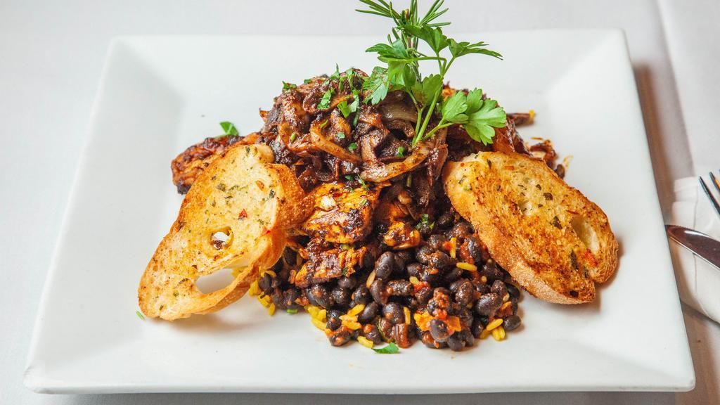 Bourbon Street Chicken & Shrimp · Cajun grilled chicken and shrimp topped with sautéed onions and mushrooms, served over black beans and rice.