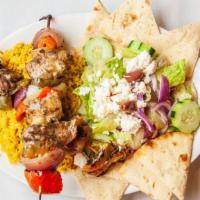 Chicken Shish Kebab · Served with rice, pita bread, and Greek salad.