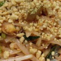 Pad Thai · Hot and spicy stir-fried oriental style noodles with egg, bean sprouts, basil leaves, peanut...