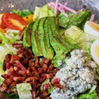 Cobb Salad · Tomato, avocado, hard-boiled egg, bacon, roquefort cheese, and ranch.
