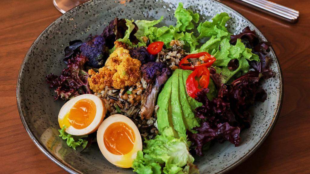 Grain Bowl · Vegetarian. Quinoa, spelt, wild rice, roasted cauliflower, marinated egg, avocado, and pickled fresnos.
