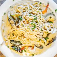 Fettucini Alfredo O Marinara (Seafood Feast) · A combination of mussels, clams, calamari, crab cluster, shrimp, and twin lobster tails in a...