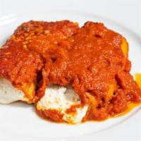 Melanzane Rollatini · Rolled eggplant stuffed with ricotta and mozzarella and baked in tomato sauce.