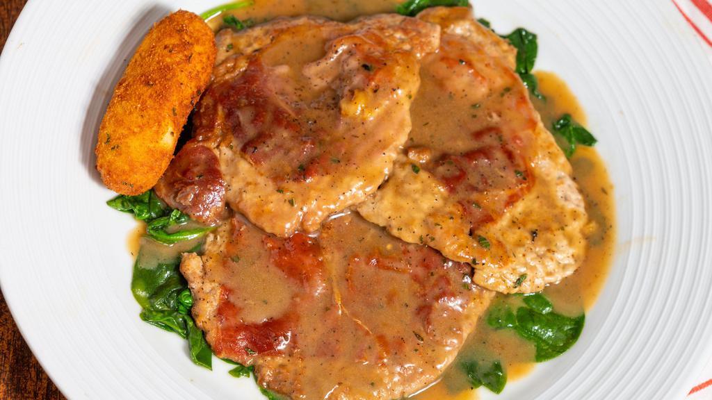 Saltimbocca Alla Romano · Veal topped with prosciutto in a butter-sage sauce. Served with a potato croquette and the chef's choice of vegetable.