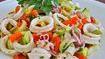 Fresh Calamari Salad · Mixed greens, fresh tomatoes, lettuce, green peppers red peppers, cucumbers, onions parsley and olive oil lemon juice dressing.