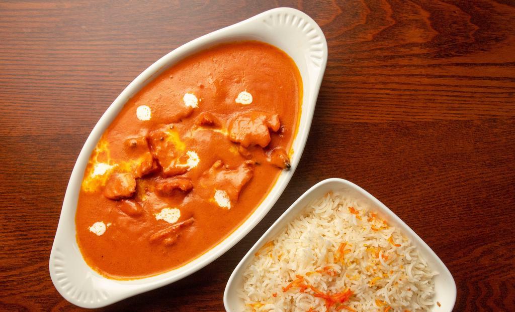 Chicken Tikka Masala · Tandoor- fired, creamy tomato sauce.