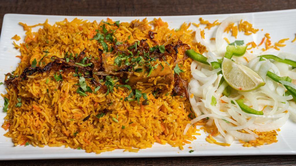 Chicken Biryani · Rice cooked with small chicken pieces with bones & strong aromatic spices.