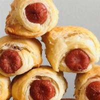Walter'S Pigs In A Blanket (Frozen) · Walter's cocktail sized hot dogs, wrapped in all butter, bakery made puff pastry. 12 per ord...