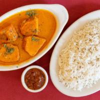 Chicken Tikka Masala · Boneless white meat chicken simmered in a tomato cream sauce with garlic, ginger, and bell p...