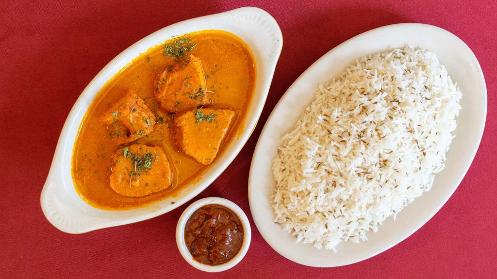 Chicken Makhani · Boneless chicken marinated and grilled in the clay oven with mango chutney and creamy sauce, comes with rice