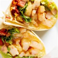 Shrimp & Avocado Wrap · Sautéed shrimp, melted swiss, avocado, crispy bacon, lettuce, tomato, and ranch dressing in ...