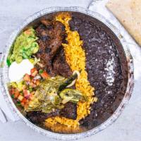 Carne Asada · Grilled tender skirt steak topped with mixtures of onions and poblano peppers served with ri...