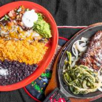 Tampiquenas · Char-grilled sirloin steak with a  cheese enchilada and poblano rajas served with Mexican, r...