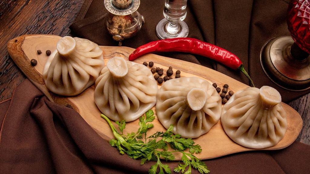 Khinkali · Oversized hand-rolled juicy dumplings, filled with seasoned organic meat and herbs. (Not your average dumplings, served boiled or fried).