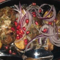 Abkhazura · Organic grass-fed ground lamb or beef and pork with herbs and pomegranate seeds, served with...