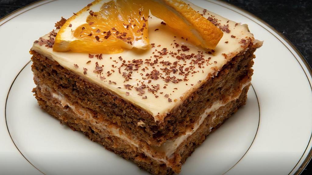 Orange Cake · Orange and walnut biscuit, iced with homemade Bavarian cream.