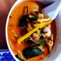 Red Curry · Thai red curry cooked in coconut milk with zucchini and bamboo shoot.