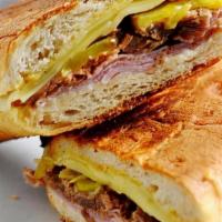 Cuban · Roasted Pork, sliced ham, Swiss cheese, pickles, mustard.