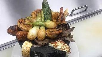 Molcajete · Grilled chicken, steak, shrimp, chorizo, cheese, jalapenos, cactus and spring onions.