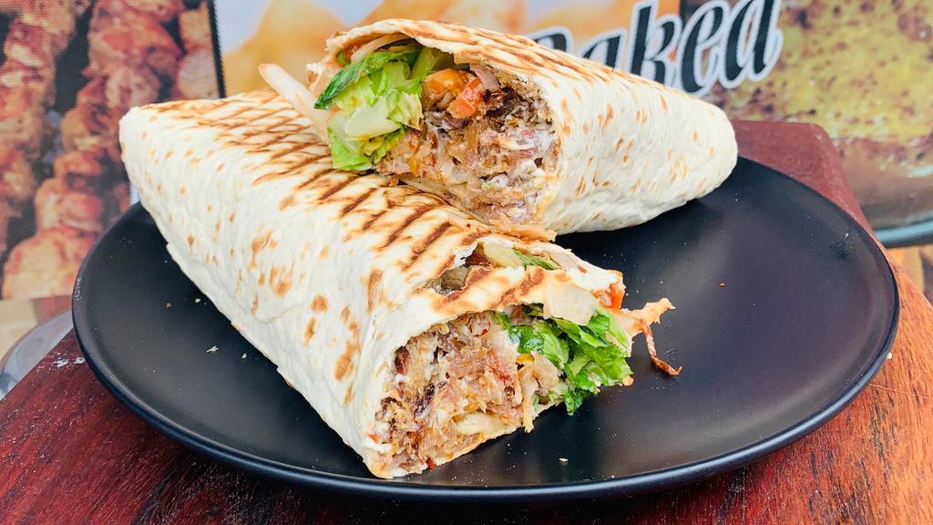 Mix Standart(10Inch) Shawarma · Pork  and chicken meat roasted on a slowly turning grill,cut into slices with onion,lettuce,tomato,hot peppers,ketchup and mayonnaise wrapped in lavash bread  and toasted.
