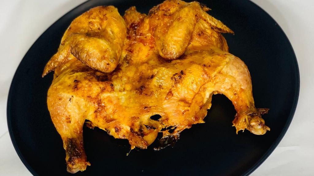 Chicken Tabaka · Fried chicken with spices.