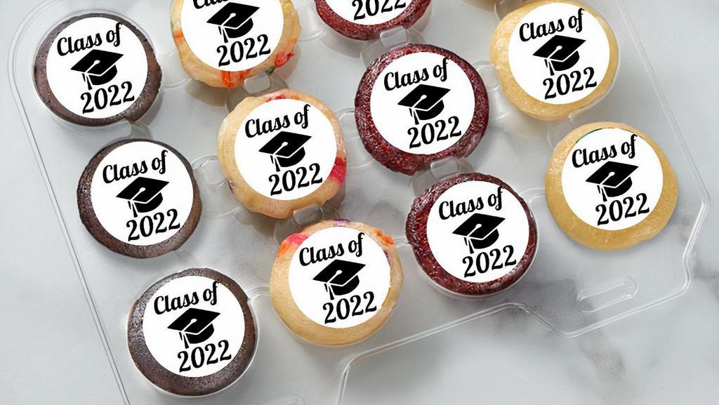 Class Of 2022 Mini Cupcakes · PACKAGE DETAILS
- Your choice of 1 Dozen, 2 Dozen, 3 Dozen Mini Cupcakes

HOW IT SHIPS
- Ships ready to serve

STORAGE INSTRUCTIONS
- You can store your SPOTS at room temperature for up to 5 days and in the refrigerator for 2 weeks. 
- You can freeze your SPOTS up to 2 months - take them out at least 20 minutes before you serve them.