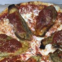Alla Melenzana Pie · Fresh tomato basil sauce and Mozzarella topped with sliced battered eggplant, spotted with s...