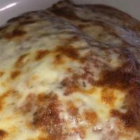 Chicken Parmigiana · Breaded chicken cutlets topped with tomato sauce and Mozzarella cheese. Served with choice o...
