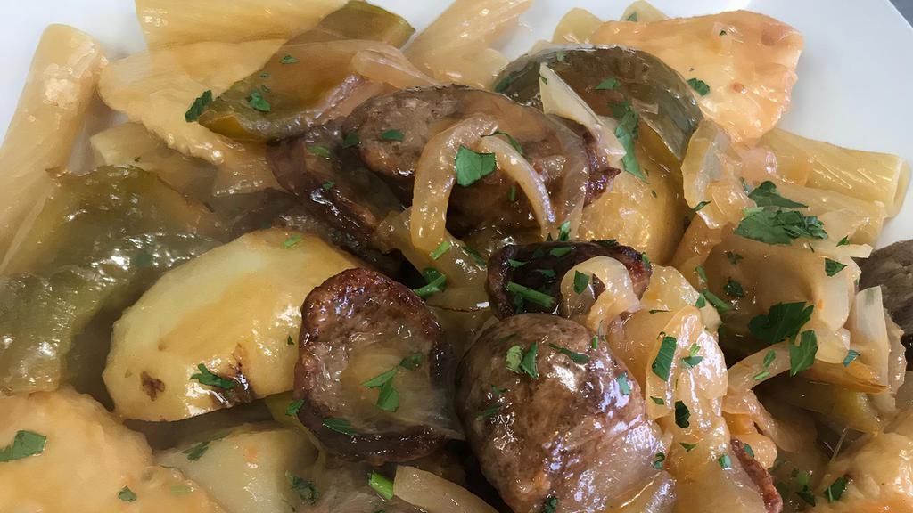Chicken Scarpariello · Tender pieces of chicken breast sautéed in a white wine sauce with sausages, peppers, olives, and potatoes. Served with choice of side.