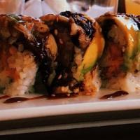 Fantasy Roll (8) · Spicy tuna, crunch, crab meat with avocado, eel and salmon on top.