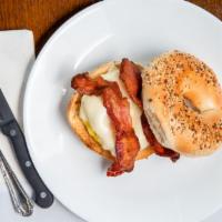 Egg & Cheese + Optional Meat Choices · Freshly made eggs on a bagel, wrap or ciabatta roll with butter and cheese.
(optional bacon,...
