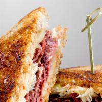 Grilled Reuben · Marbled Rye, thousand islands, sliced corned beef, sauerkraut, swiss cheese. With Fries.