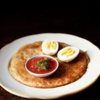 Malawach With Egg · Mediterranean pancake, boiled egg, green awaze and grated tomatoes.