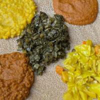 Ethiopian Veggie Combo For 1 · Vegan. Shiro, atakilt, messer, kik alicha, gomen, and injera.