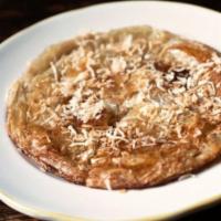 Malawach With Honey · A pancake golden brown with roasted pancake and honey.