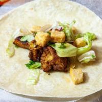 Chicken Caesar Wrap · Al white meat chicken breast grilled and sliced over lettuce, Caesar croutons, and Caesar dr...