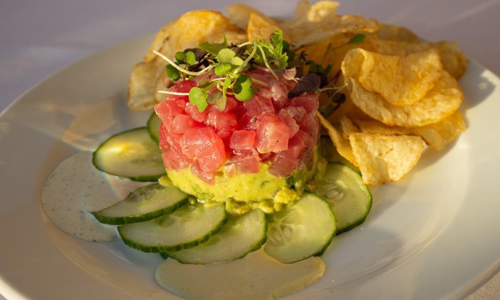 Tuna Tartare · Raw yellow-fin tuna, avocado salad, cucumber, and wasabi mayo.
