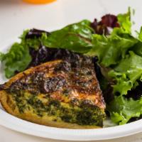Spinach Gruyère Quiche · Vegetarian. Garlic sautéed spinach and Gruyère cheese in a flaky pastry crust served with a ...