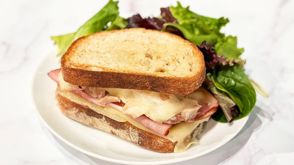 Chicken Cordon Bleu Melt · Tender braised chicken thighs, sliced Black Forest ham, and melted Swiss cheese, with Dijon cream cheese and garlic butter, on fresh-baked sourdough. Served warm, with a side salad with Dijon vinaigrette.