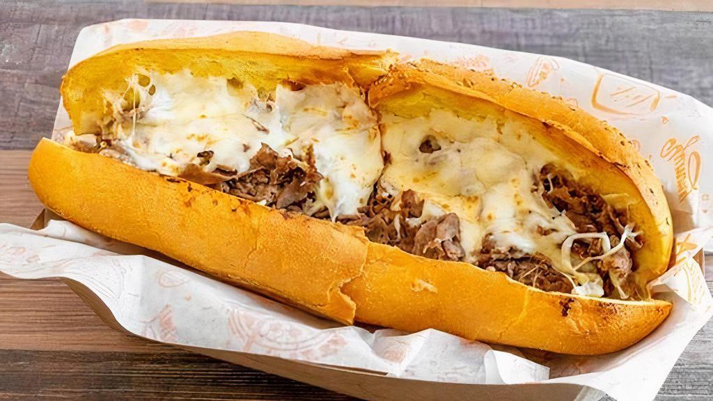 Philly Cheese Steak Sub! · sliced ribeye steak with cheese, served with choice of grilled onions, peppers and mushrooms.