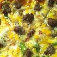 Italian Cheesesteak Pizza · Pizza with cheesesteak, peppers, onions, and American cheese.