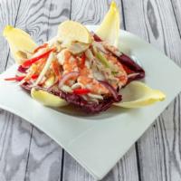 Italian Seafood Salad · Bay scallops, Gulf shrimp, calamari, scungili, and black olives tossed in extra virgin olive...
