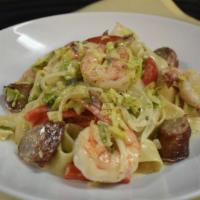 Pappardelle Sausage And Shrimp · Sautéed shrimp, sausage, onions, red peppers, brussels sprouts, tossed in a white wine cream...
