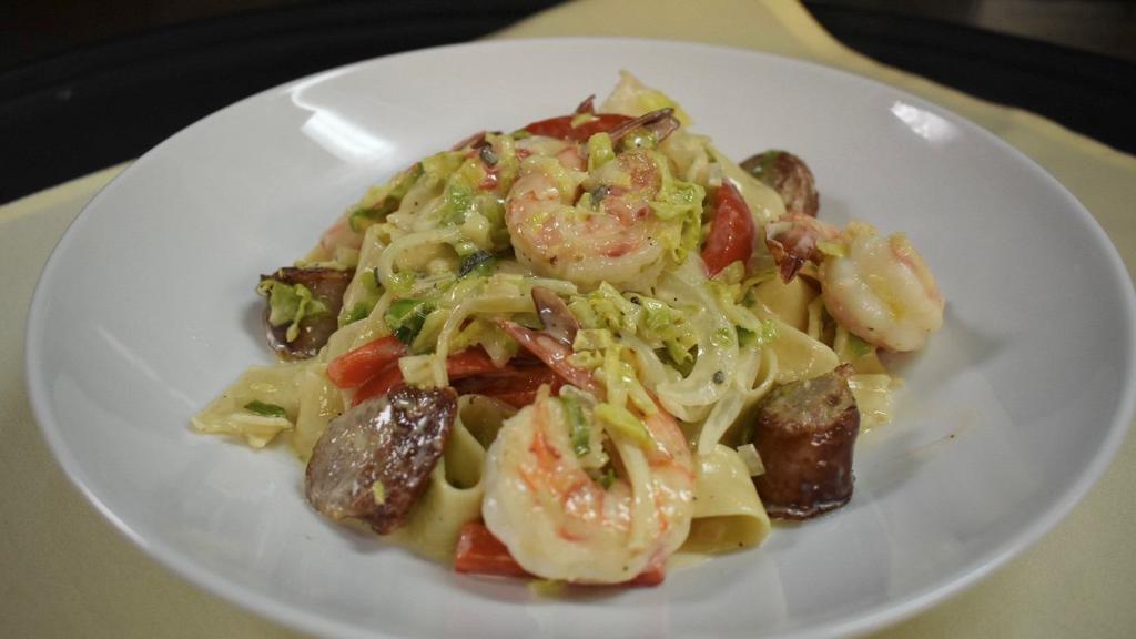 Pappardelle Sausage And Shrimp · Sautéed shrimp, sausage, onions, red peppers, brussels sprouts, tossed in a white wine cream sauce and finished with sage